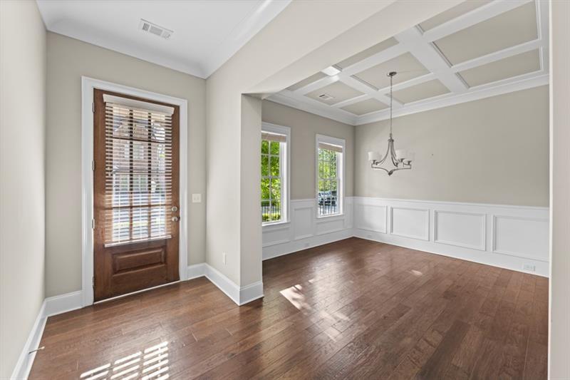 6454 Meridian Way Atlanta, GA 30328 - Photo 8 of 63 an empty room with wooden floor and windows