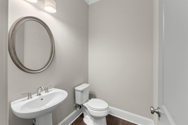 6454 Meridian Way Atlanta, GA 30328 - Photo 9 of 63 a bathroom with a sink and a mirror