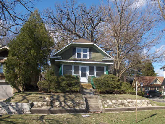 2126 Rural Street Rockford, IL 61107 - Photo 1 of 6 a front view of a house with a yard