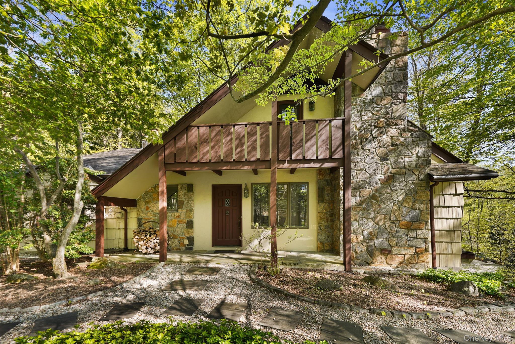 334 Pine Brook Road Pound Ridge, NY 10506 - Photo 1 of 28 a view of a white house with large windows and a small yard