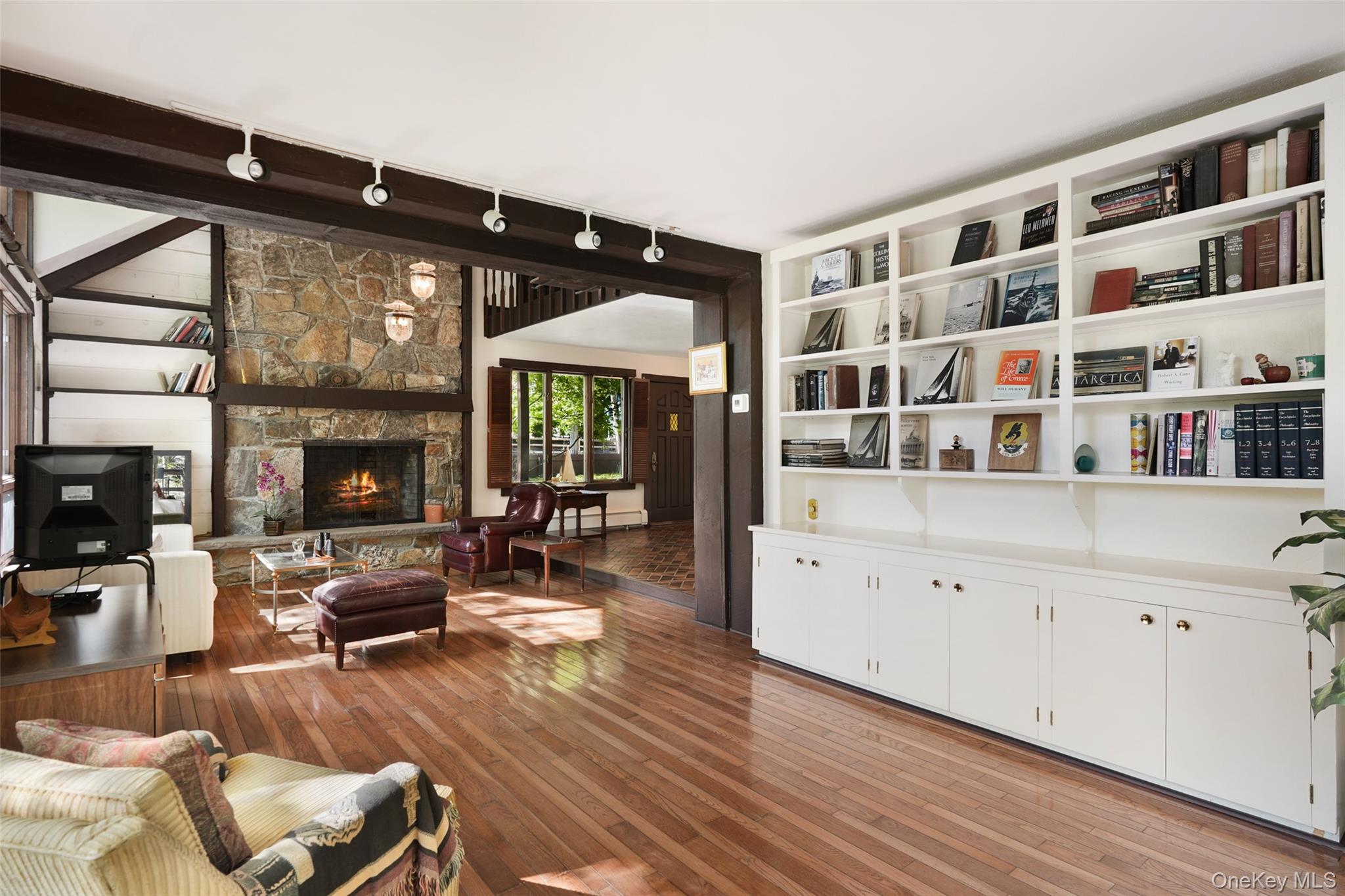 334 Pine Brook Road Pound Ridge, NY 10506 - Photo 12 of 28 a living room with furniture large window and wooden floor