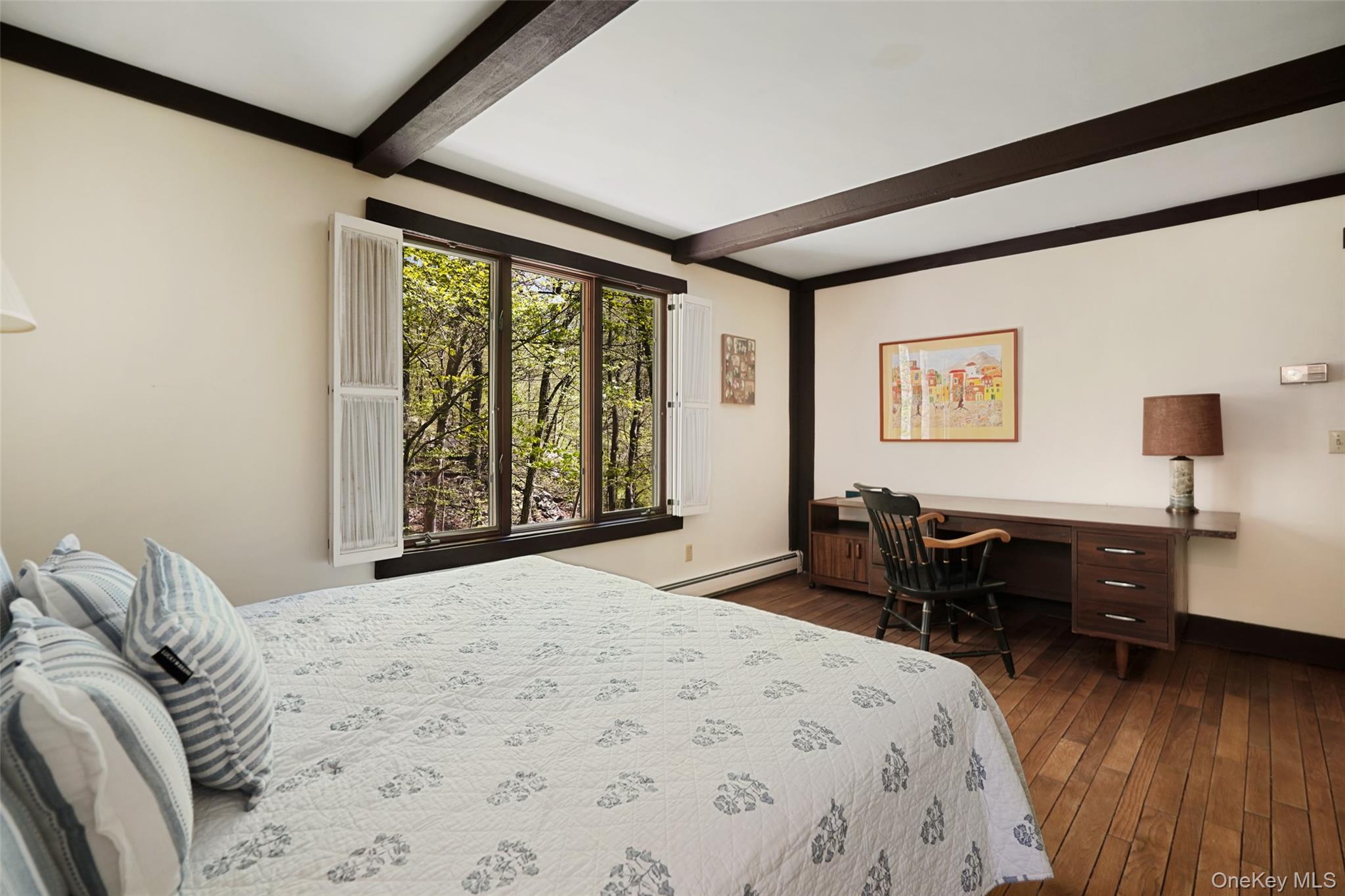 334 Pine Brook Road Pound Ridge, NY 10506 - Photo 14 of 28 a bedroom with a bed and a large window