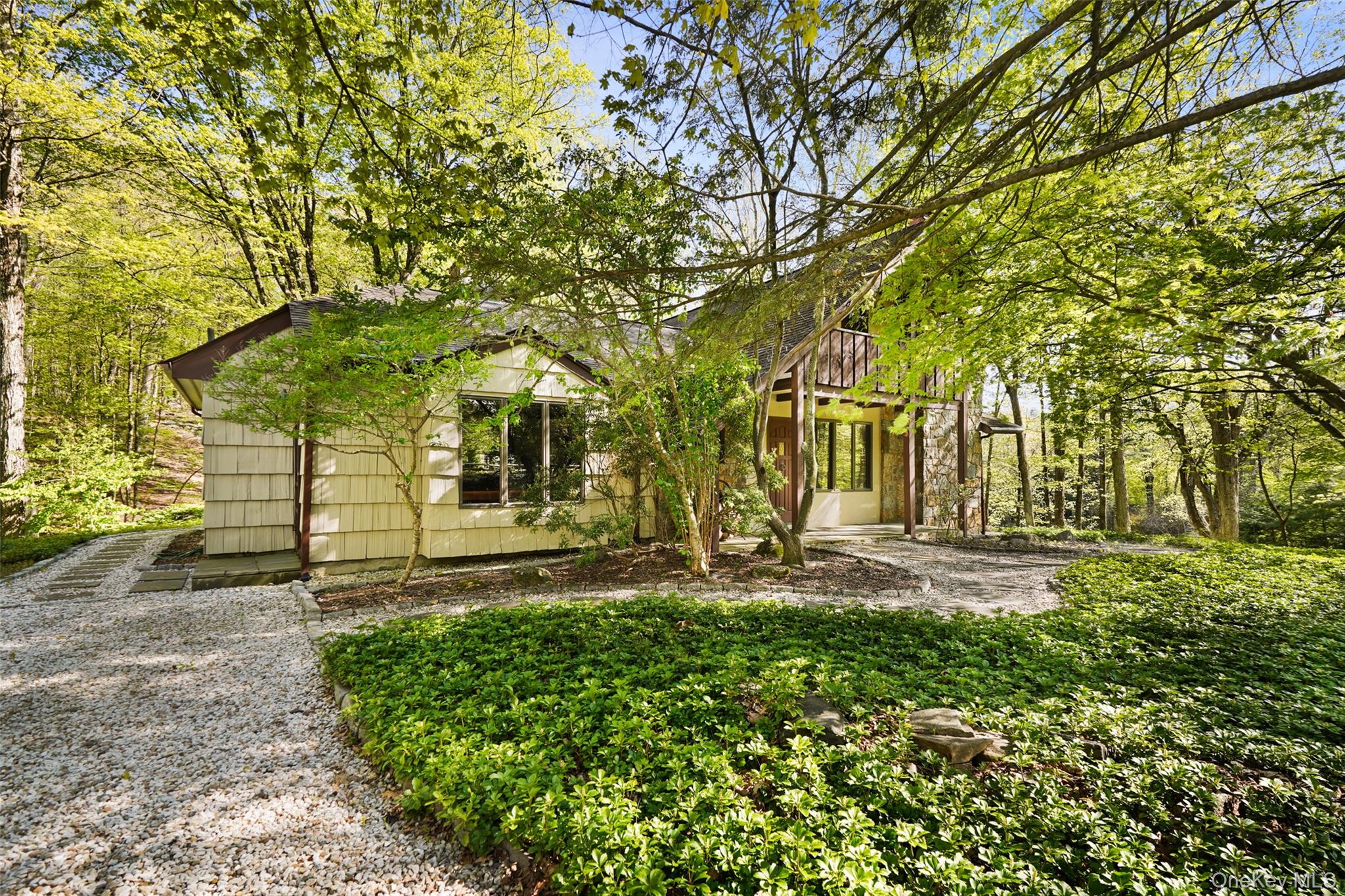 334 Pine Brook Road Pound Ridge, NY 10506 - Photo 2 of 28 a front view of a house with a yard