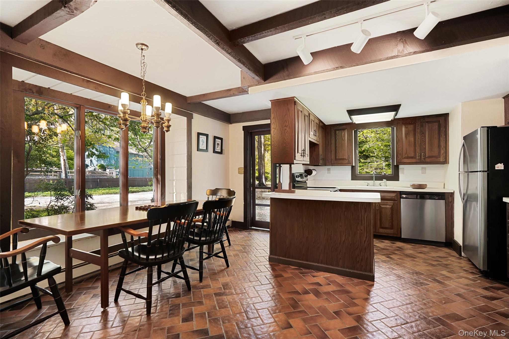 334 Pine Brook Road Pound Ridge, NY 10506 - Photo 21 of 28 a large kitchen with a table and chairs