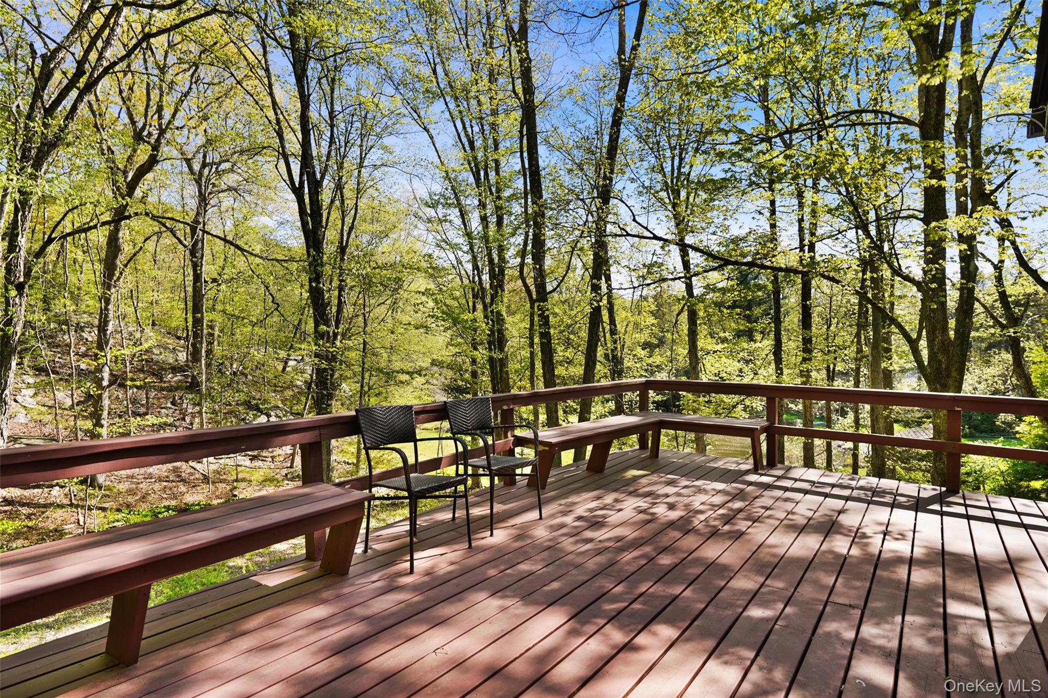 334 Pine Brook Road Pound Ridge, NY 10506 - Photo 9 of 28 a view of a chairs and table on the deck