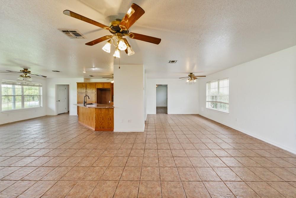 4316 Leona Road Bowie, TX 76230 - Photo 10 of 37 a view of a kitchen with furniture and a kitchen view
