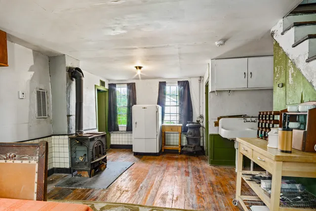 a kitchen with refrigerator and window