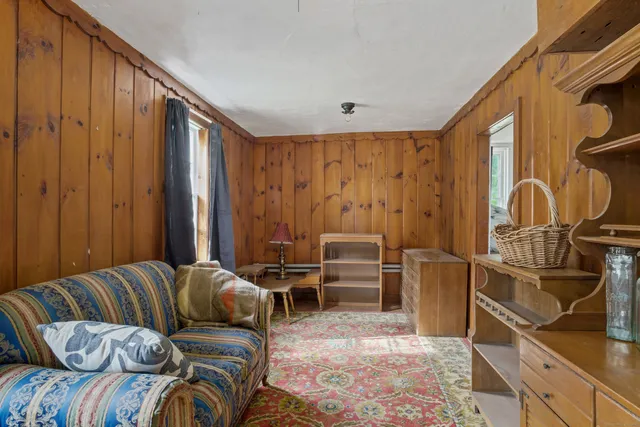 a bedroom with a bed and dresser