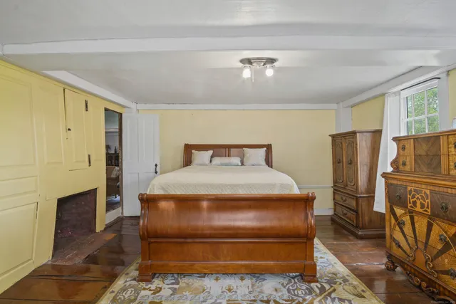 a spacious bedroom with a bed and a couch