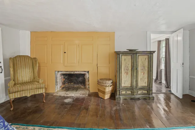 a living room with fireplace furniture and a fireplace