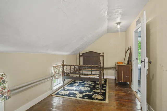 a view of a balcony with wooden floor