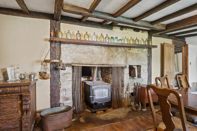 a garage with a fireplace and furniture