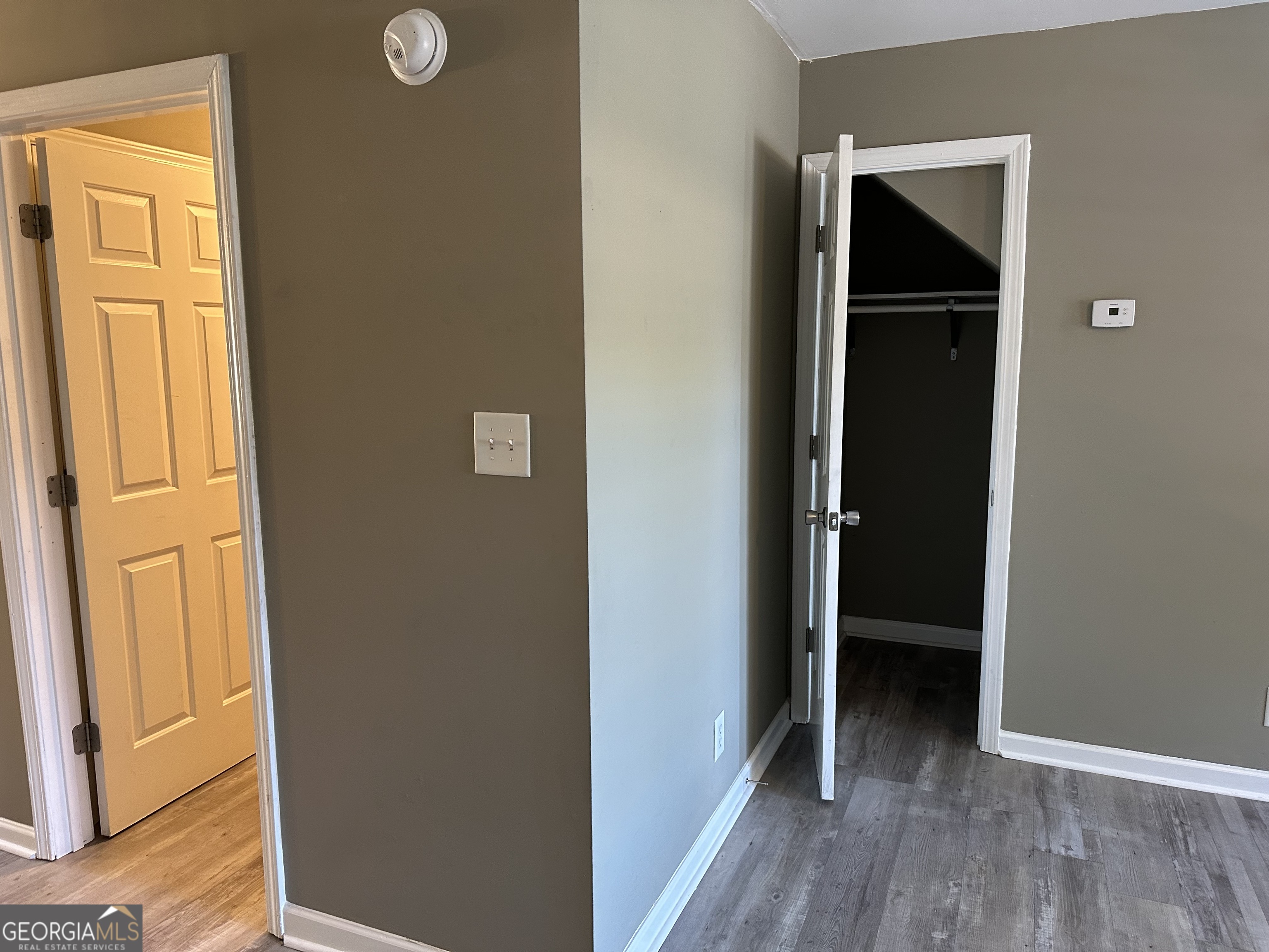 205 Maret Street Hartwell, GA 30643 - Photo 19 of 38 a view of a hallway with wooden floor and closet
