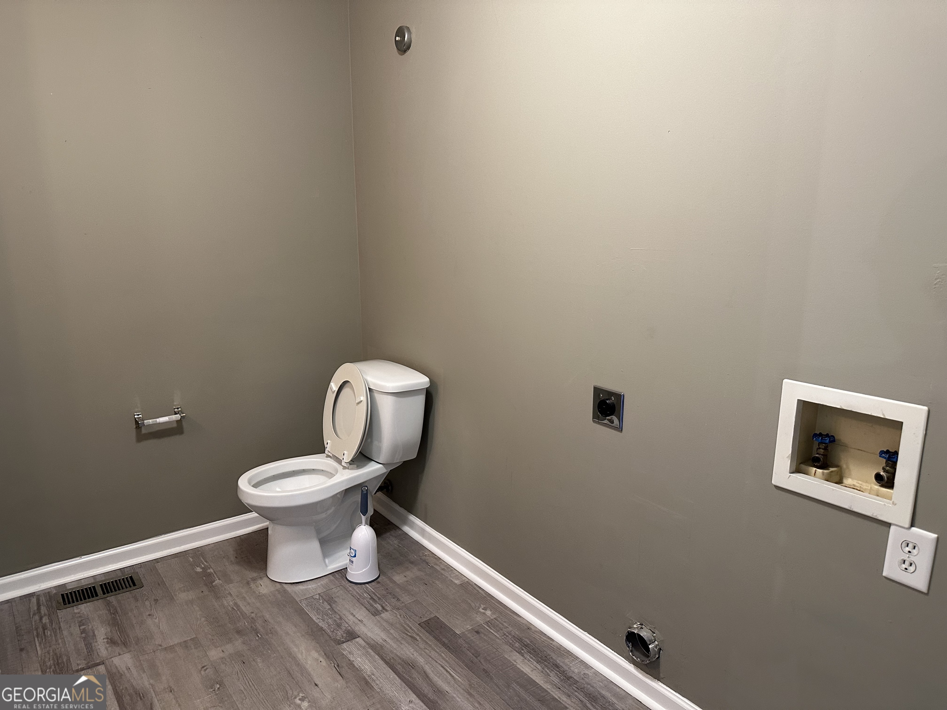 205 Maret Street Hartwell, GA 30643 - Photo 24 of 38 a white toilet sitting next to a small bathroom