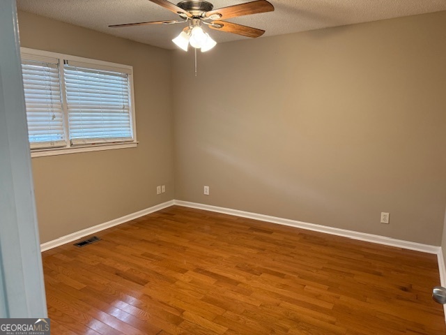 205 Maret Street Hartwell, GA 30643 - Photo 30 of 38 a view of an empty room with a window and wooden floor