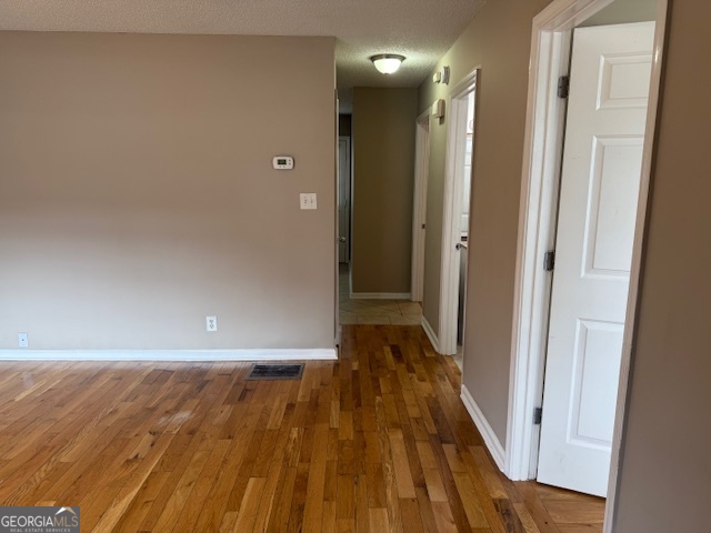 205 Maret Street Hartwell, GA 30643 - Photo 36 of 38 a view of a hallway with wooden floor
