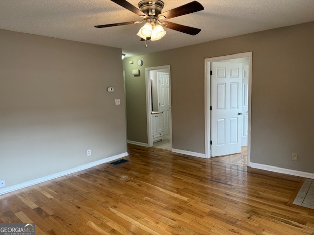 205 Maret Street Hartwell, GA 30643 - Photo 37 of 38 an empty room with wooden floor fan and windows