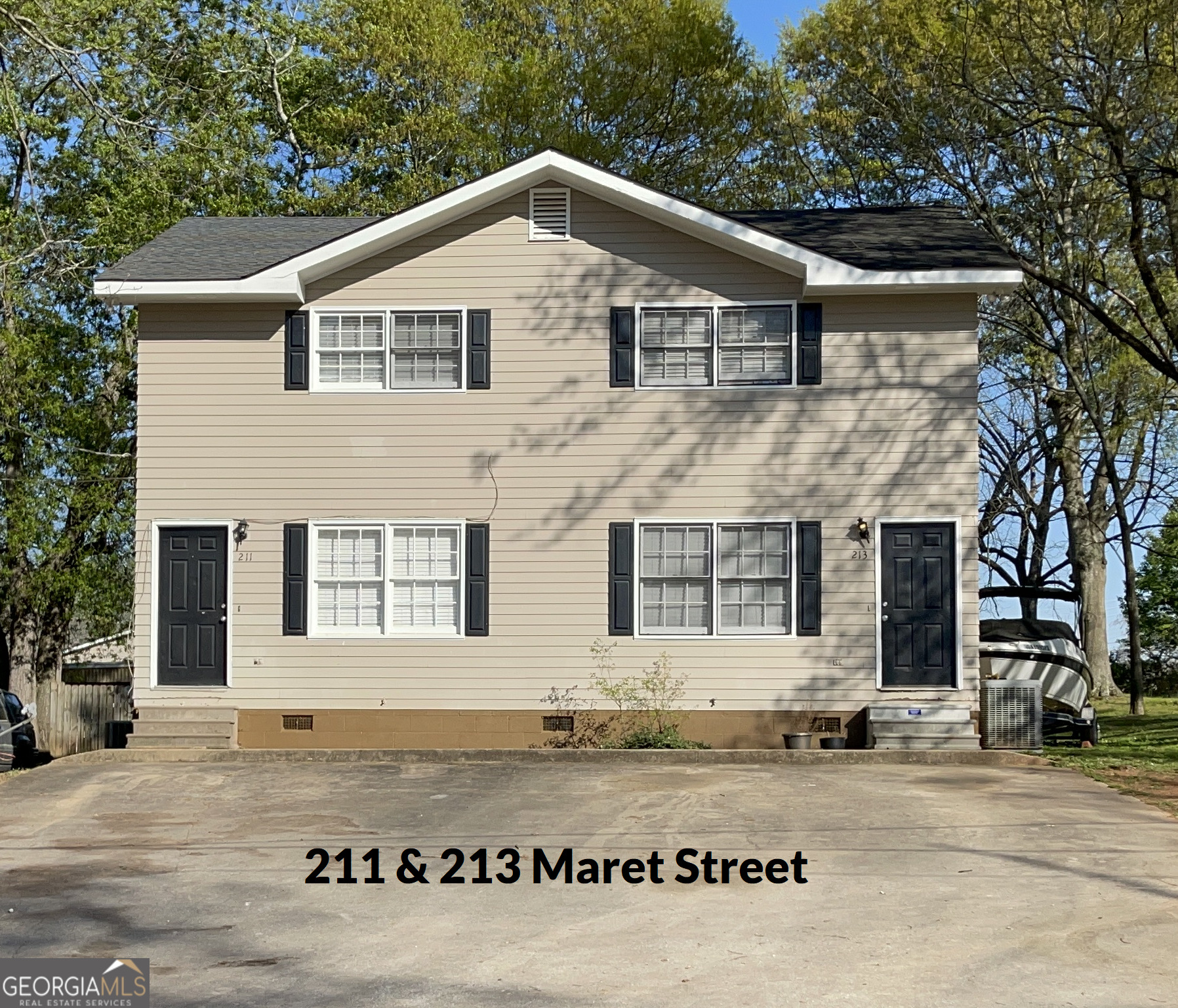 205 Maret Street Hartwell, GA 30643 - Photo 7 of 38 a front view of a house with a garden
