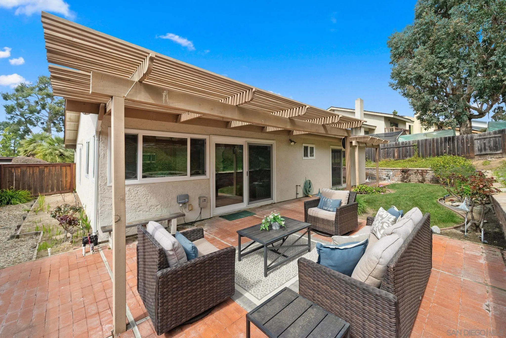 111 Little Oaks Road Encinitas, CA 92024 - Photo 15 of 25 a view of a house with backyard sitting area and garden