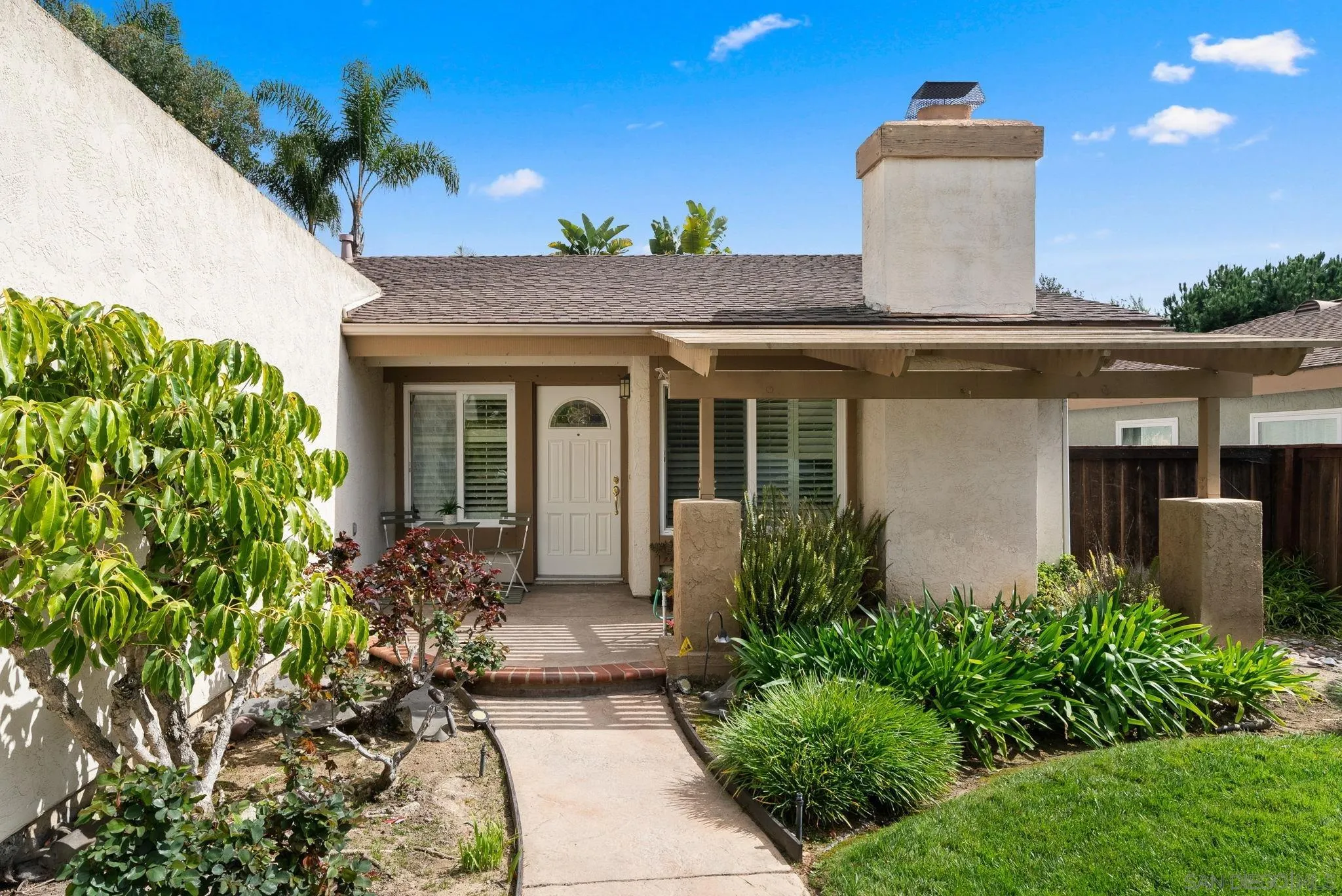 111 Little Oaks Road Encinitas, CA 92024 - Photo 19 of 25 a front view of a house with a garden