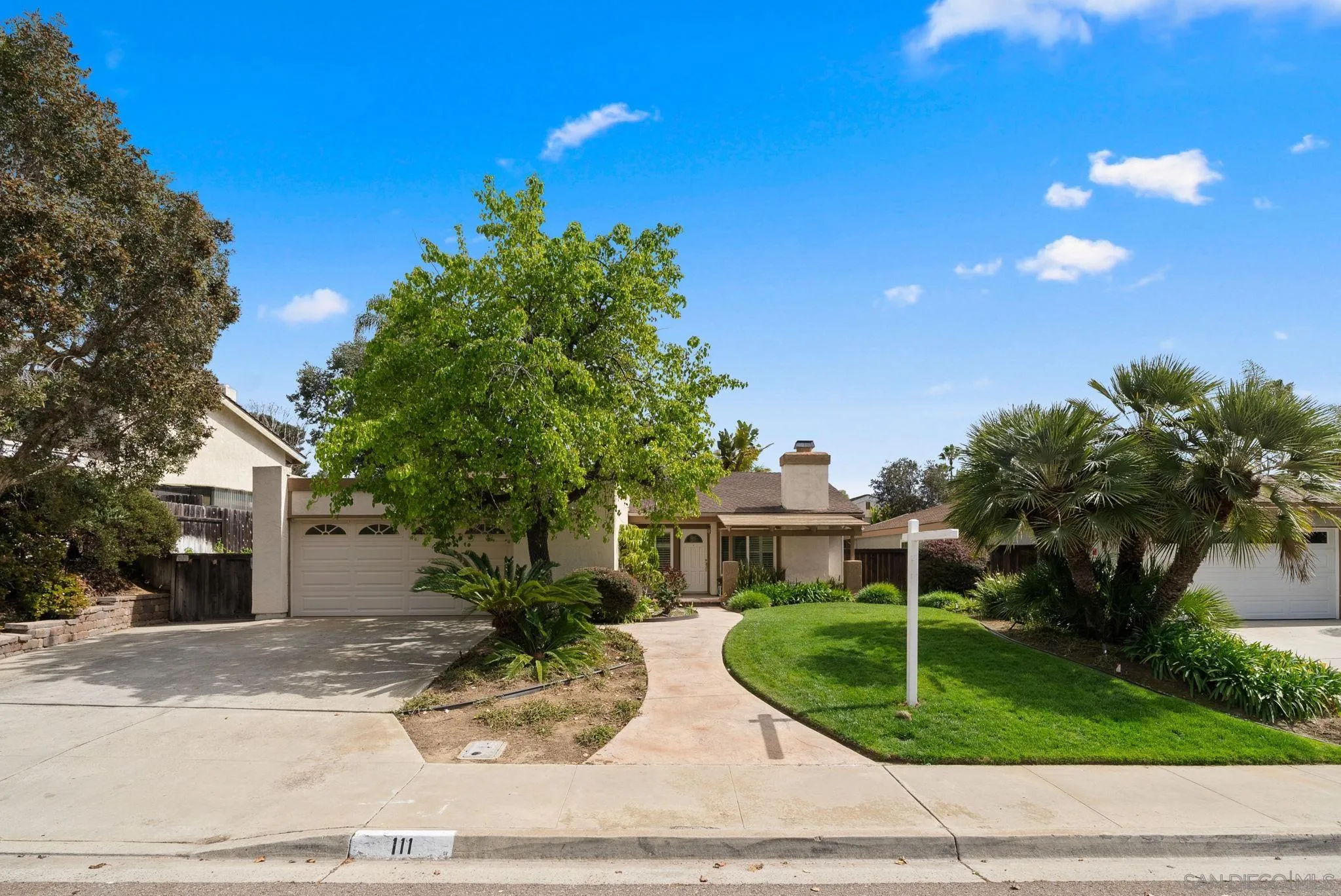 111 Little Oaks Road Encinitas, CA 92024 - Photo 20 of 25 a front view of a house with garden