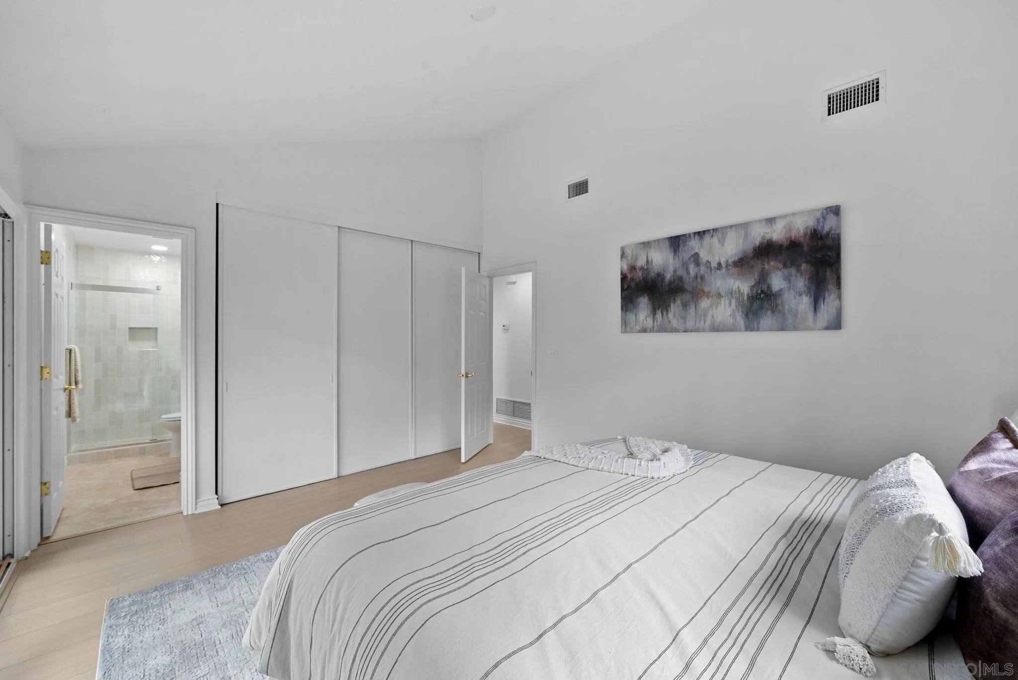 111 Little Oaks Road Encinitas, CA 92024 - Photo 5 of 25 a bedroom with a bed and a painting on the wall