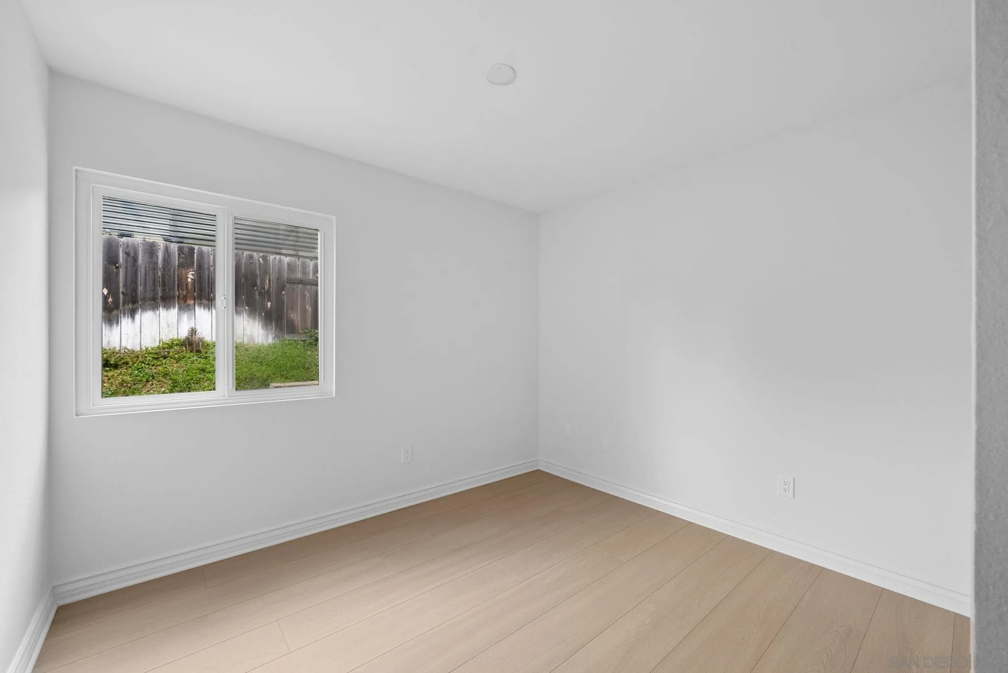 111 Little Oaks Road Encinitas, CA 92024 - Photo 10 of 25 an empty room with a window