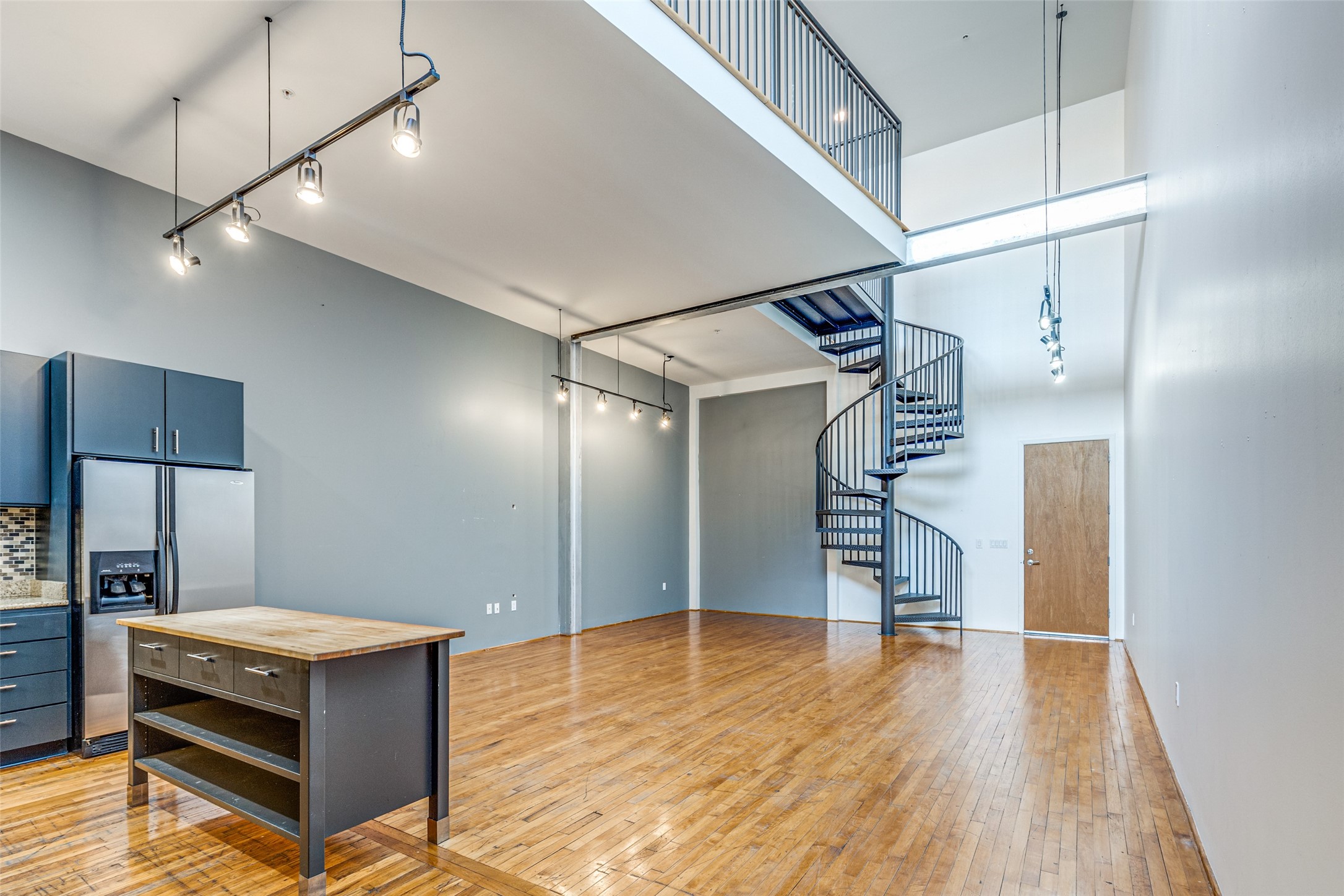 1312 Live Oak Street, Unit 223 Houston, TX 77003 - Photo 2 of 31 Kitchen-to-living transition showing seamless open-concept flow.