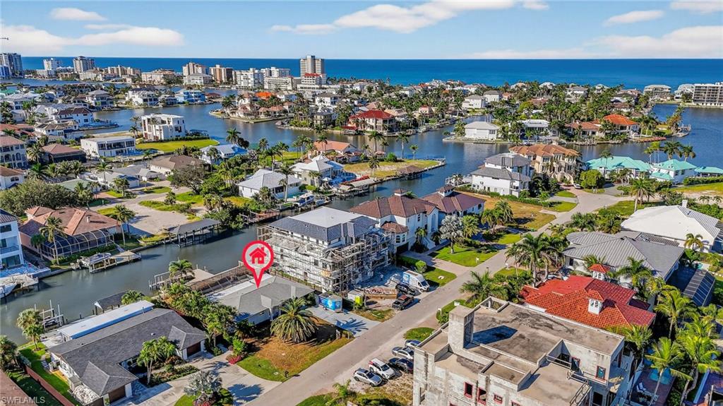 418 Seabee Avenue Naples, FL 34108 - Photo 14 of 19 Aerial perspective of suburban area with a large body of water