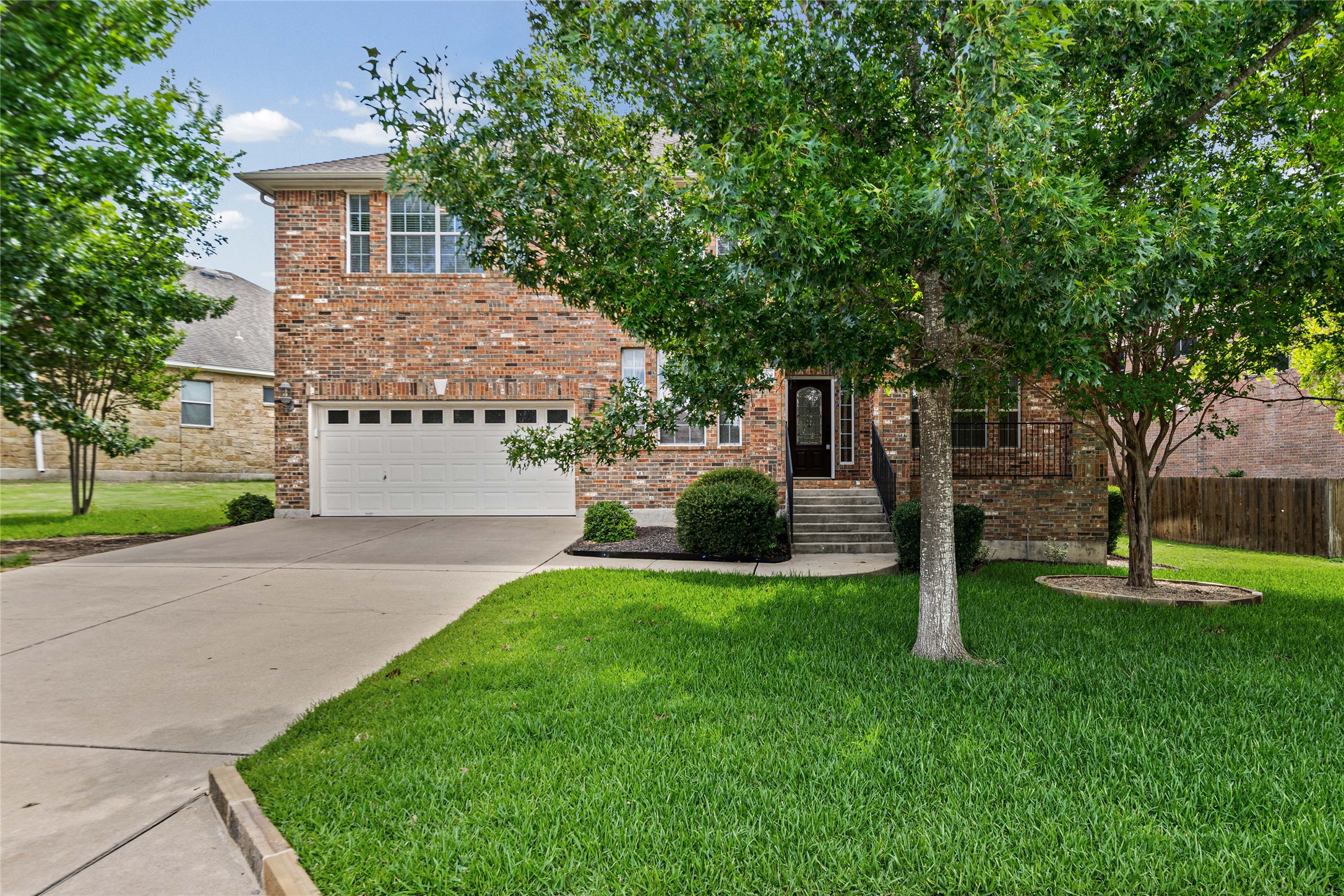 10700 Pointe View Drive Austin, TX 78738 - Photo 3 of 35 A classic brick exterior offers enduring charm and robust curb appeal.