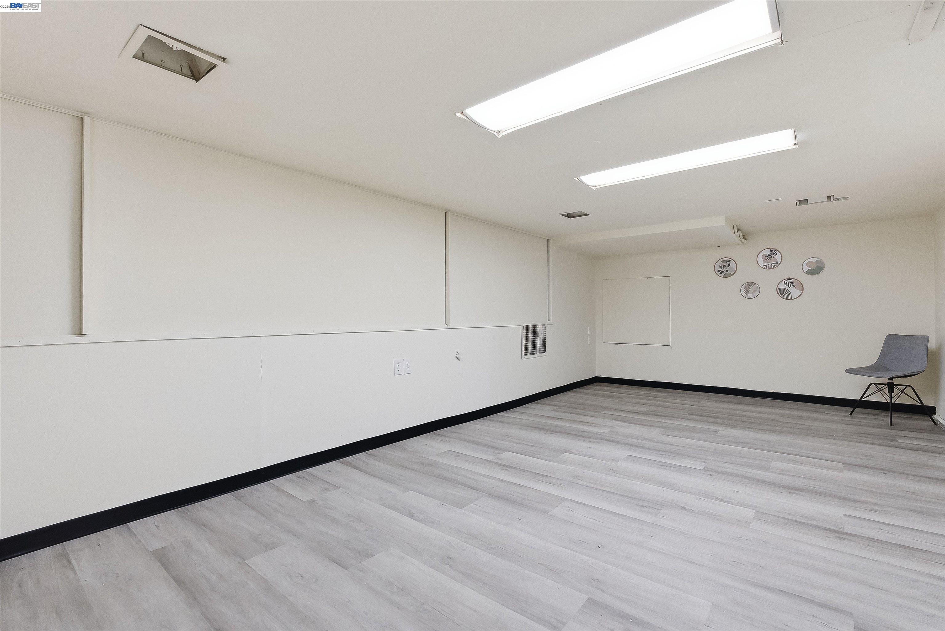 2049 Rutherford Street Oakland, CA 94601 - Photo 29 of 43 2nd large room with new flooring. Potential bedroom(s)