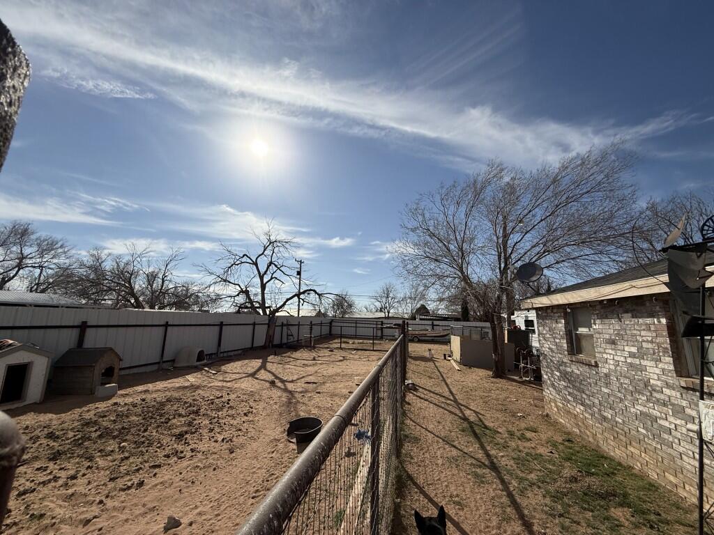 311 Northeast 3rd Seminole, TX 79360 - Photo 18 of 21 a view of outdoor space with wooden floor