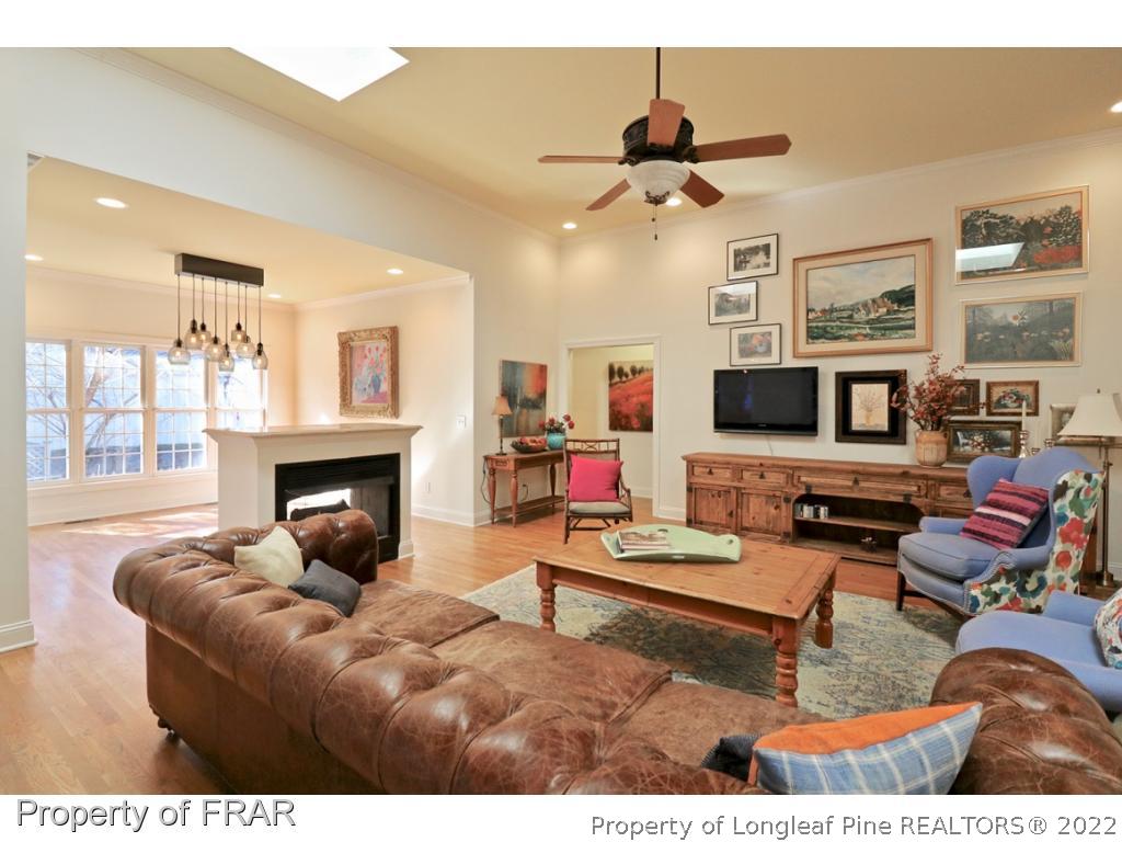 150 Lost Tree Road Pinehurst, NC 28374 - Photo 11 of 36 a living room with furniture and a fireplace