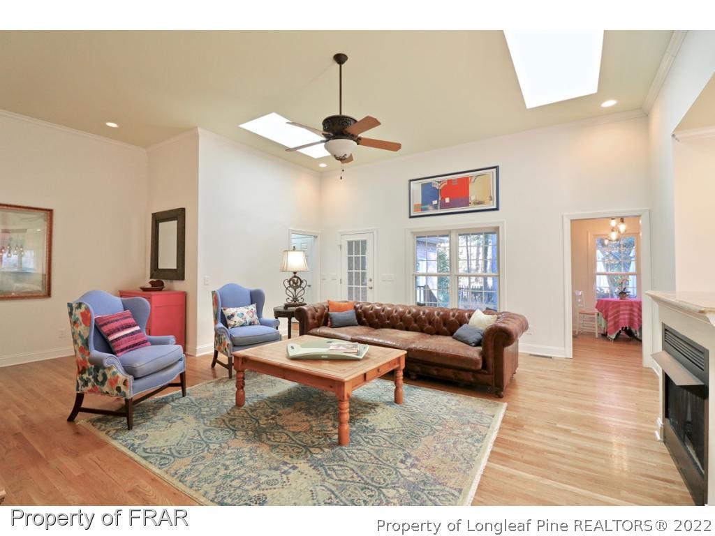 150 Lost Tree Road Pinehurst, NC 28374 - Photo 16 of 36 a living room with furniture a rug and white walls