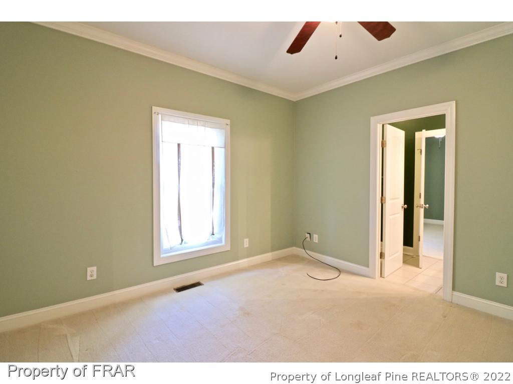 150 Lost Tree Road Pinehurst, NC 28374 - Photo 32 of 36 a view of an empty room with a window