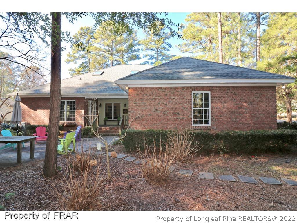 150 Lost Tree Road Pinehurst, NC 28374 - Photo 35 of 36 a backyard of a house with barbeque oven