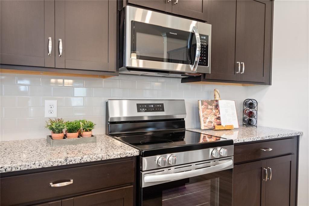 701 Sinclair Lane Temple, GA 30179 - Photo 18 of 46 a kitchen with stainless steel appliances granite countertop a sink and a stove