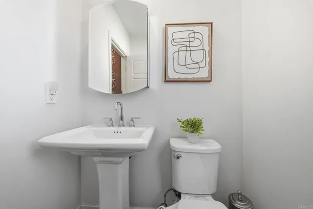 a bathroom with a toilet a sink and bath tub