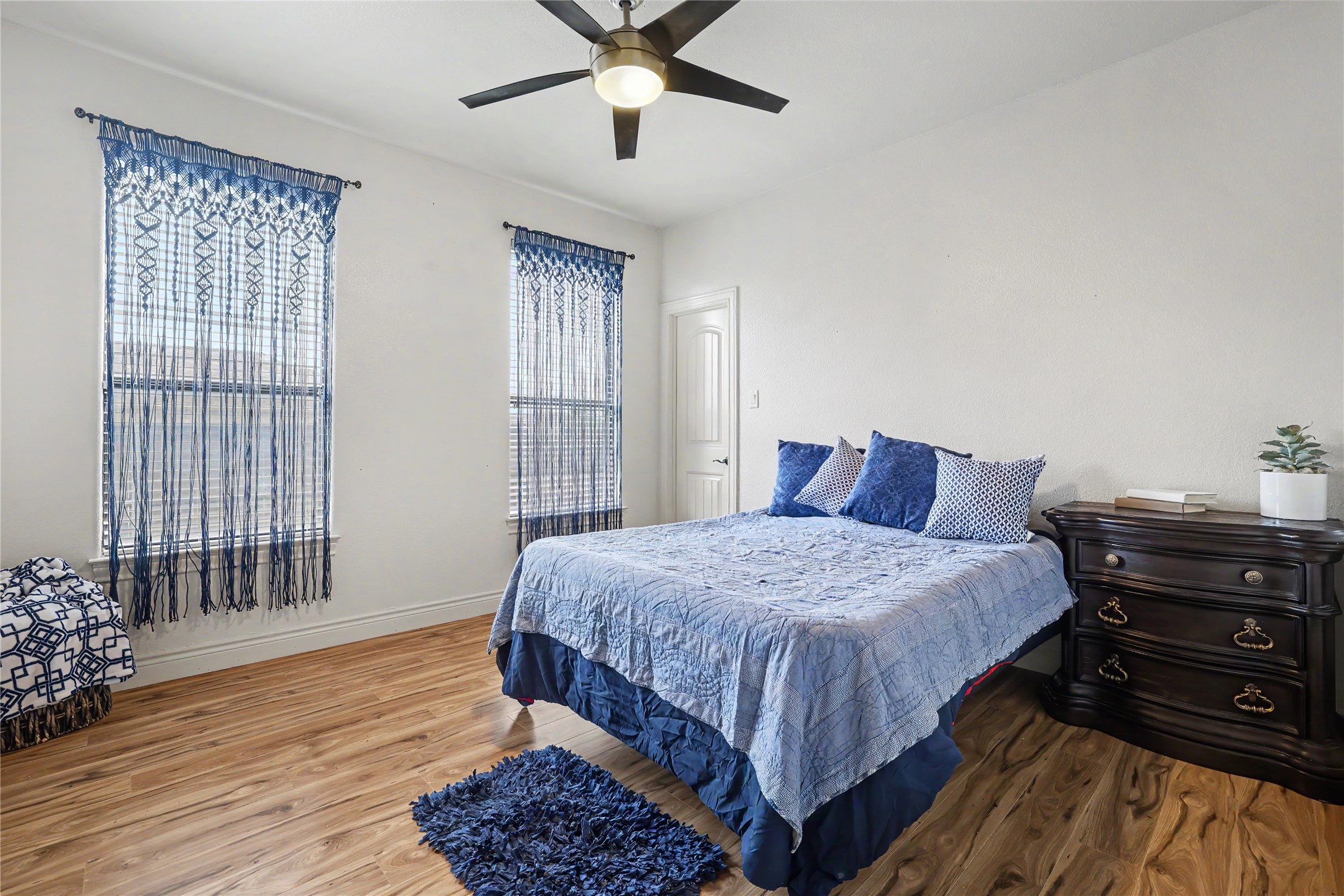 Undisclosed Address Georgetown, TX 78633 - Photo 28 of 39 a bedroom with a bed and wooden floor