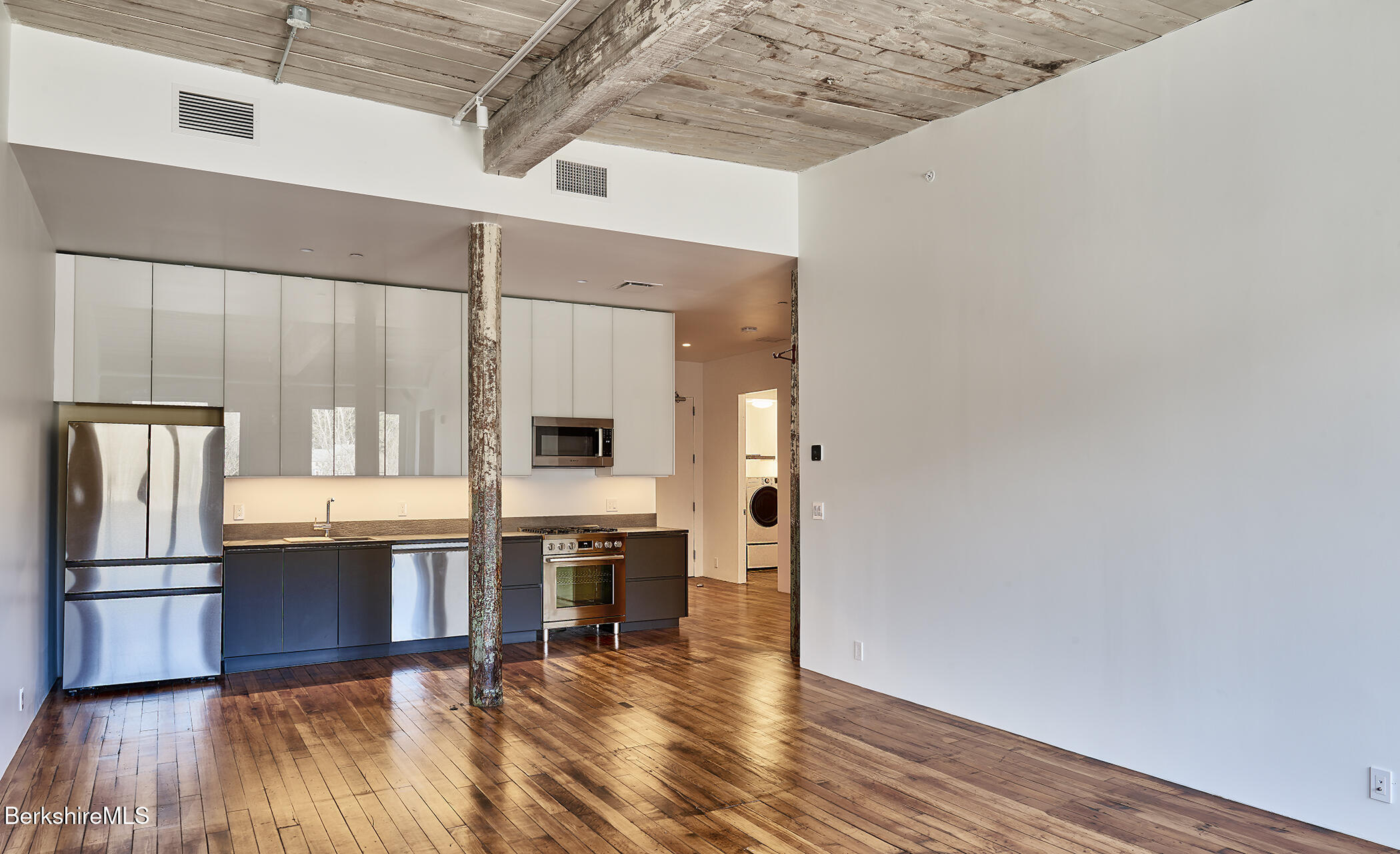 520 State Road, Unit 309 North Adams, MA 01247 - Photo 12 of 19 a view of kitchen and wooden floor