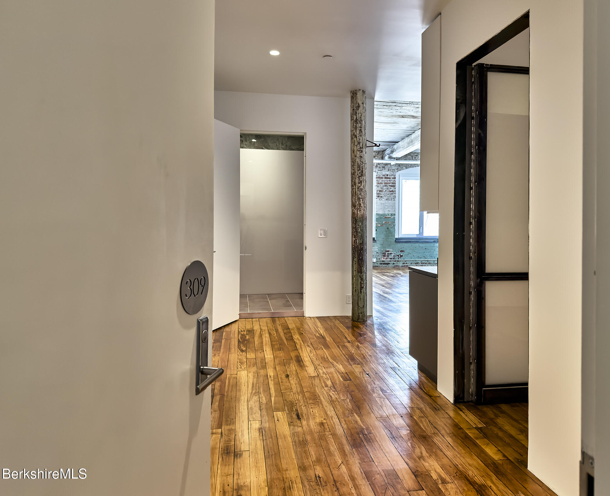 520 State Road, Unit 309 North Adams, MA 01247 - Photo 6 of 19 a bedroom with a bed and a mirror