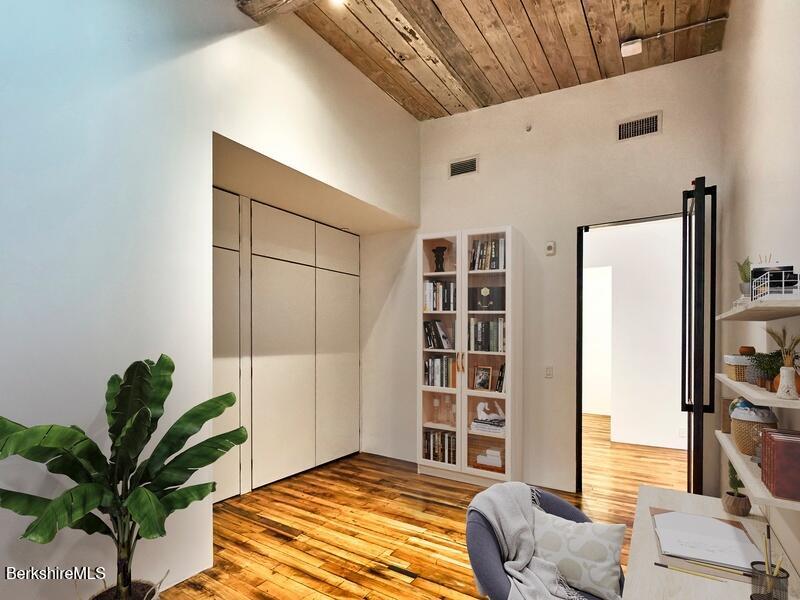 520 State Road, Unit 309 North Adams, MA 01247 - Photo 10 of 19 a bedroom with a bed and a potted plant