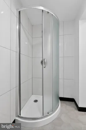 a utility room with a washing machine and a washer dryer