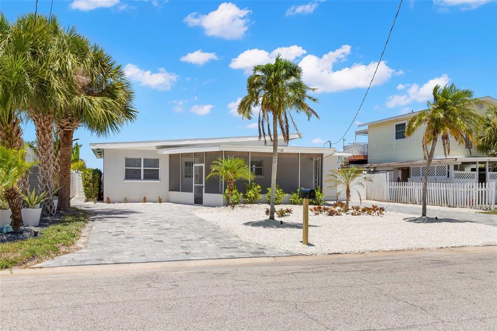 708 Sunset Cove Madeira Beach, FL 33708 - Photo 42 of 61 a view of a house with a patio