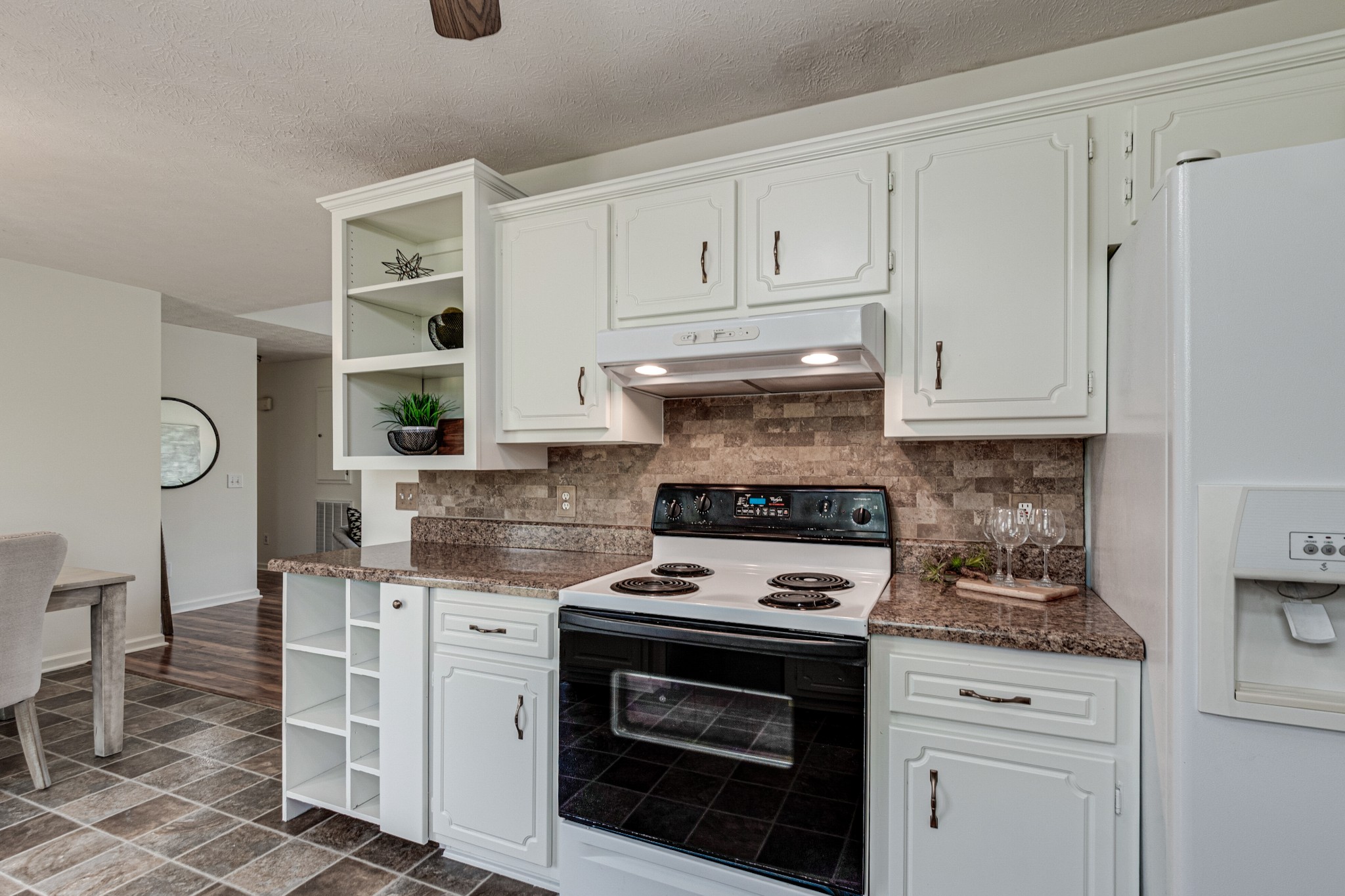 1898 Belotes Ferry Road Lebanon, TN 37087 - Photo 13 of 26 a kitchen with white cabinets and appliances