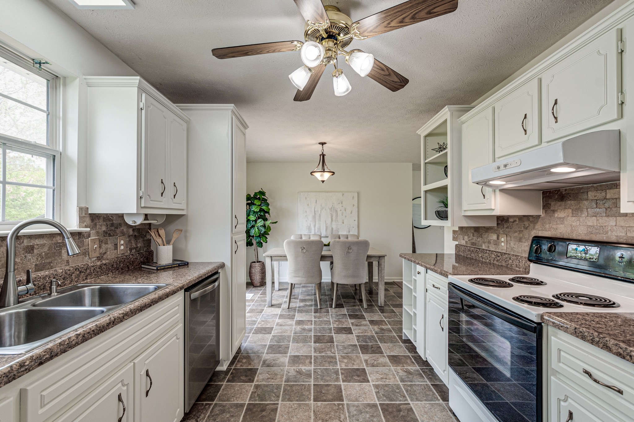 1898 Belotes Ferry Road Lebanon, TN 37087 - Photo 14 of 26 a kitchen with a stove cabinets and chairs