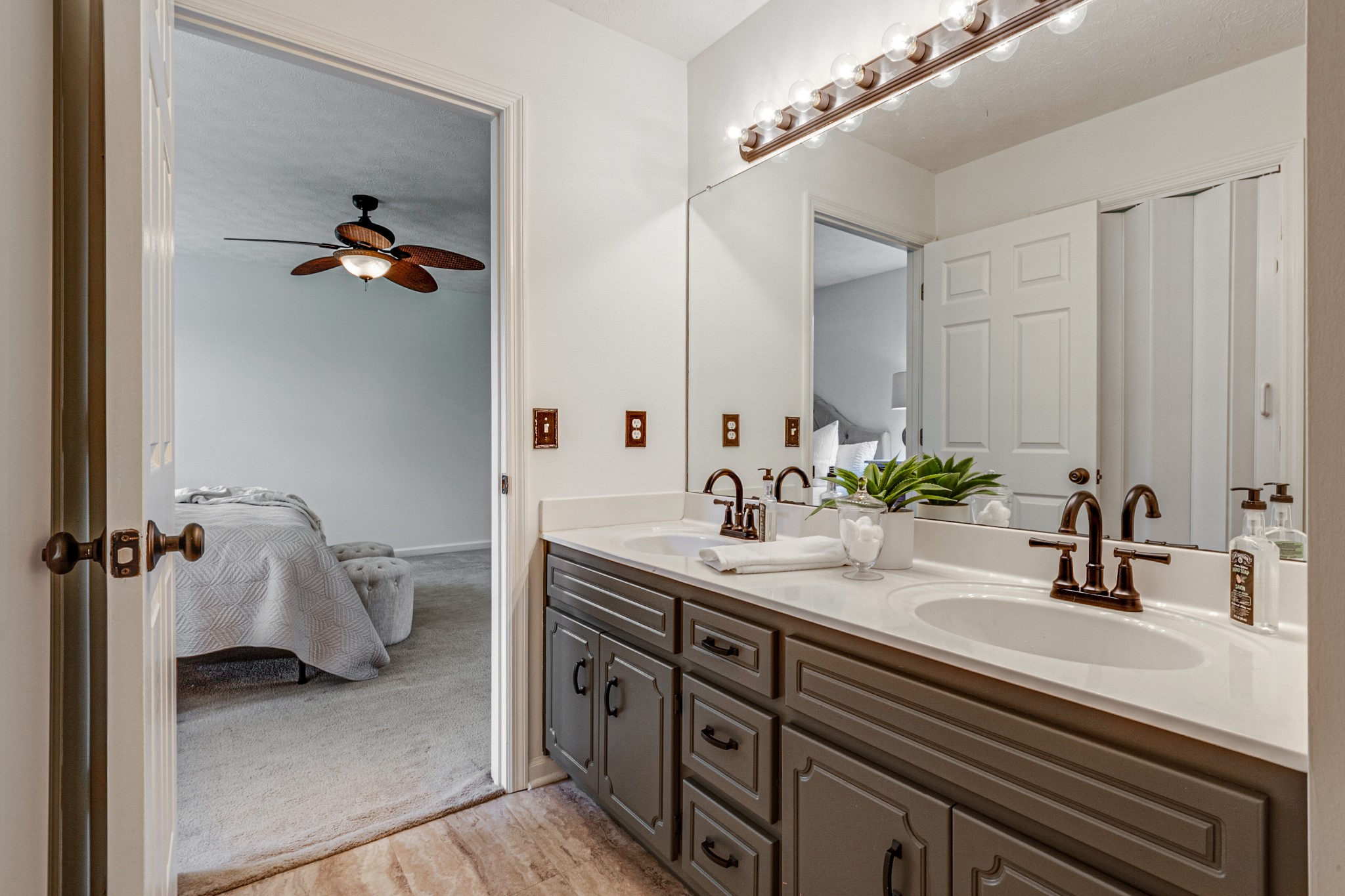 1898 Belotes Ferry Road Lebanon, TN 37087 - Photo 18 of 26 a bathroom with a sink and a mirror