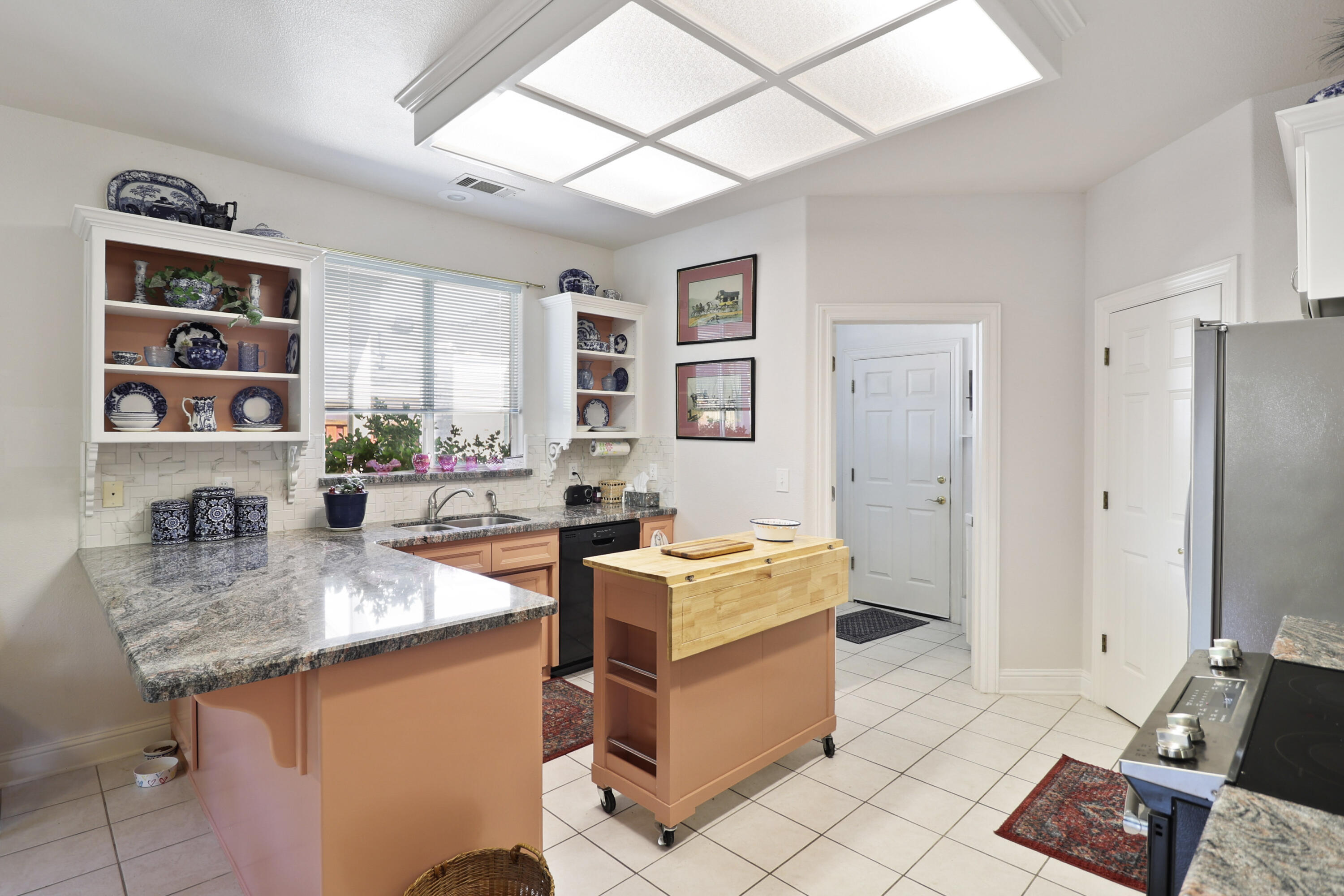 2210 Drexel Way Redding, CA 96001 - Photo 15 of 57 a kitchen with stainless steel appliances granite countertop a sink stove and cabinets