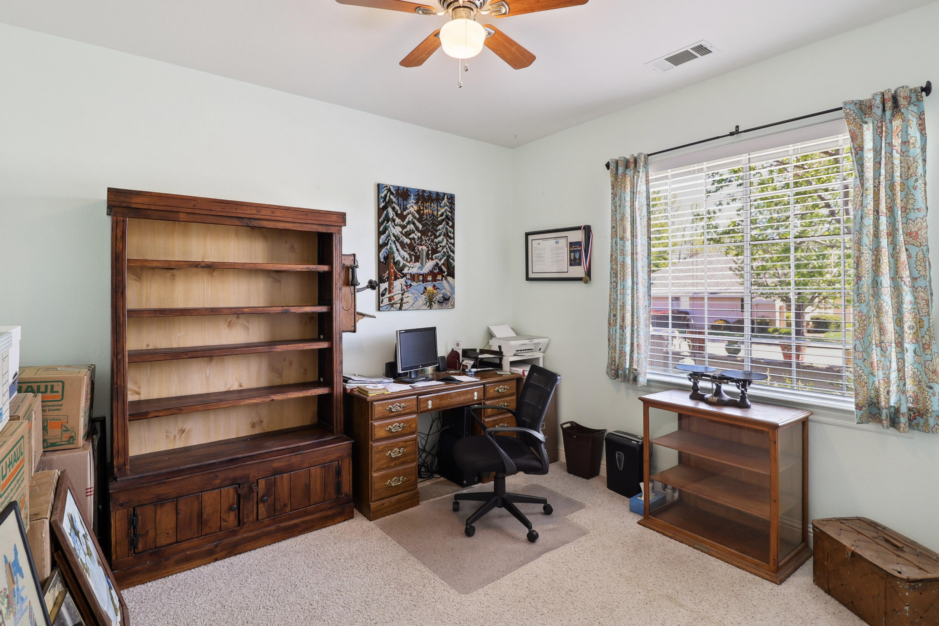 2210 Drexel Way Redding, CA 96001 - Photo 22 of 57 a view of a workspace with furniture and a window
