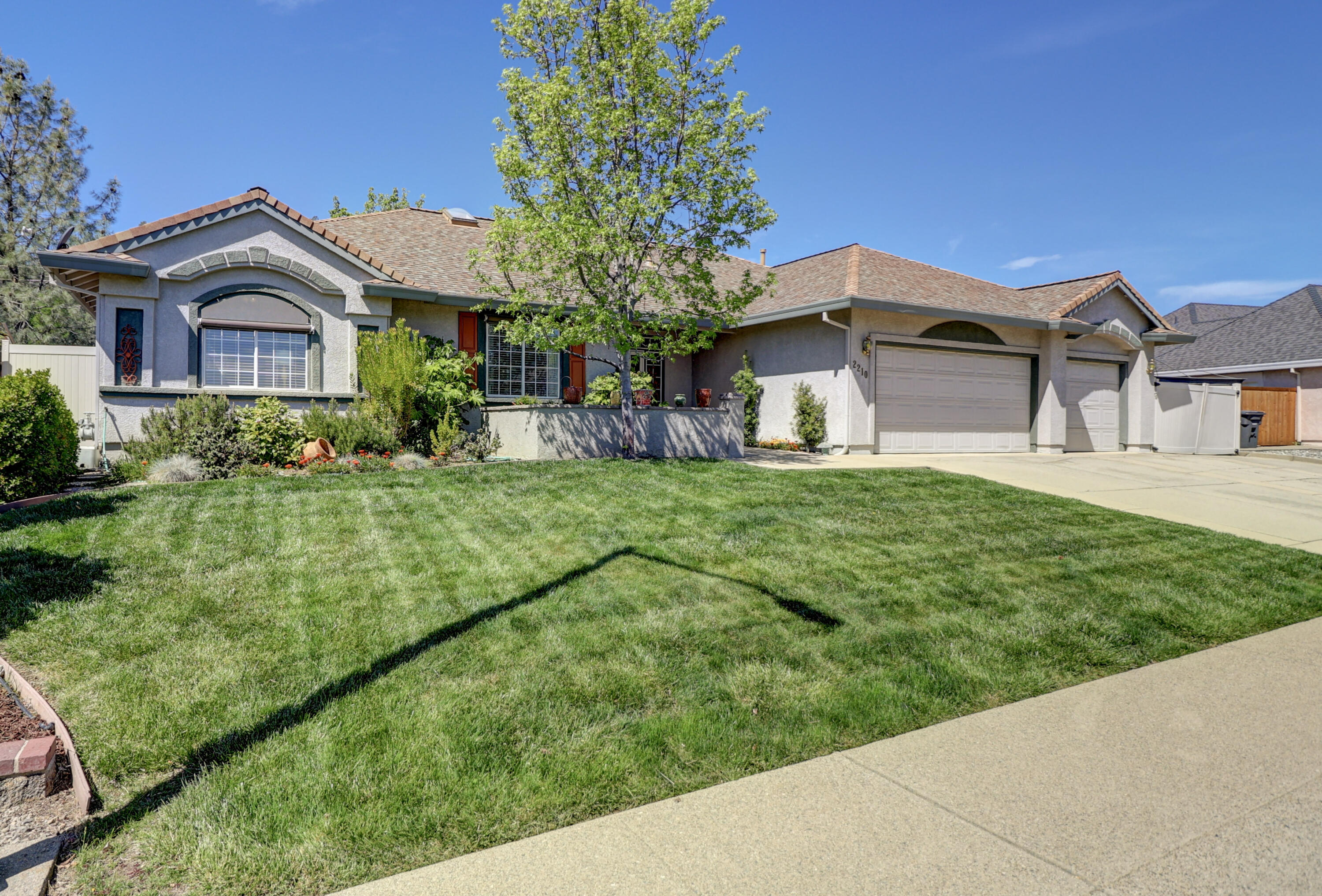 2210 Drexel Way Redding, CA 96001 - Photo 3 of 57 a front view of a house with a yard
